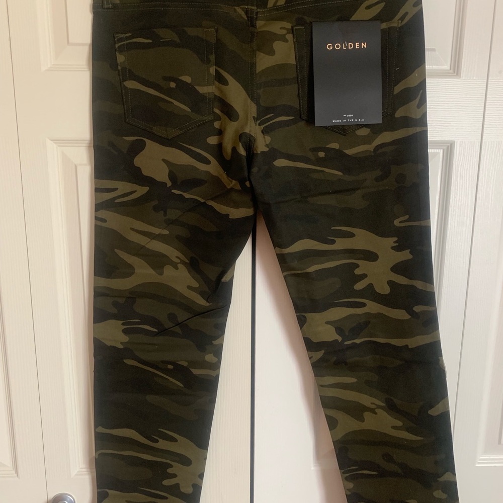 Selling a pair of camo golden denim pants.